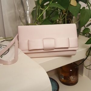 Tevolio blush colored satin wristlet